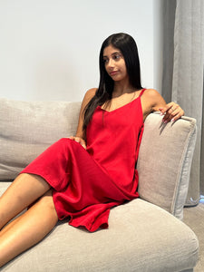 Beautiful girl wearing a red nightie on couch