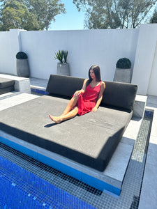 Beautiful girl wearing a red nightie on subbed near pool